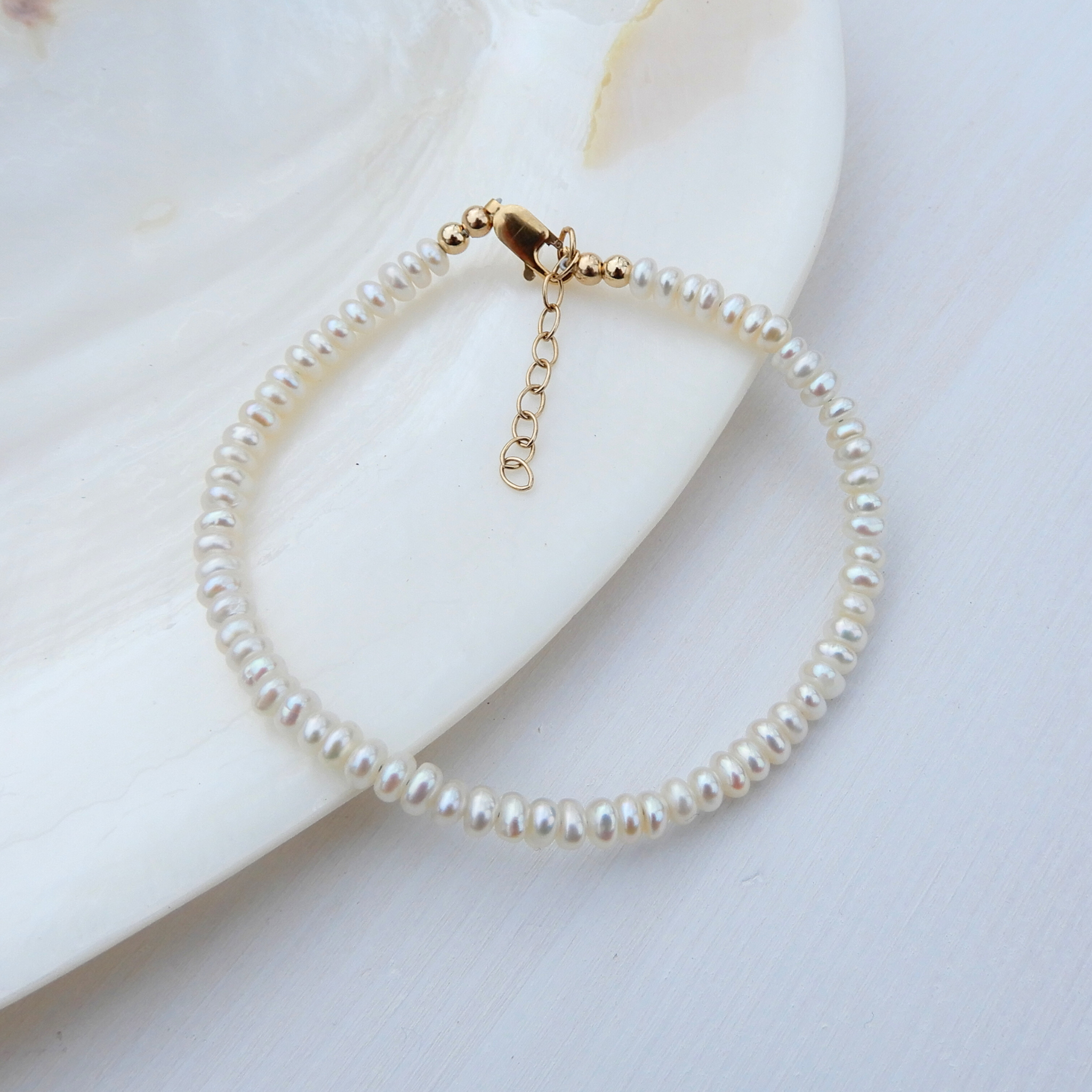 Parel armband 3,5-4mm button gold filled