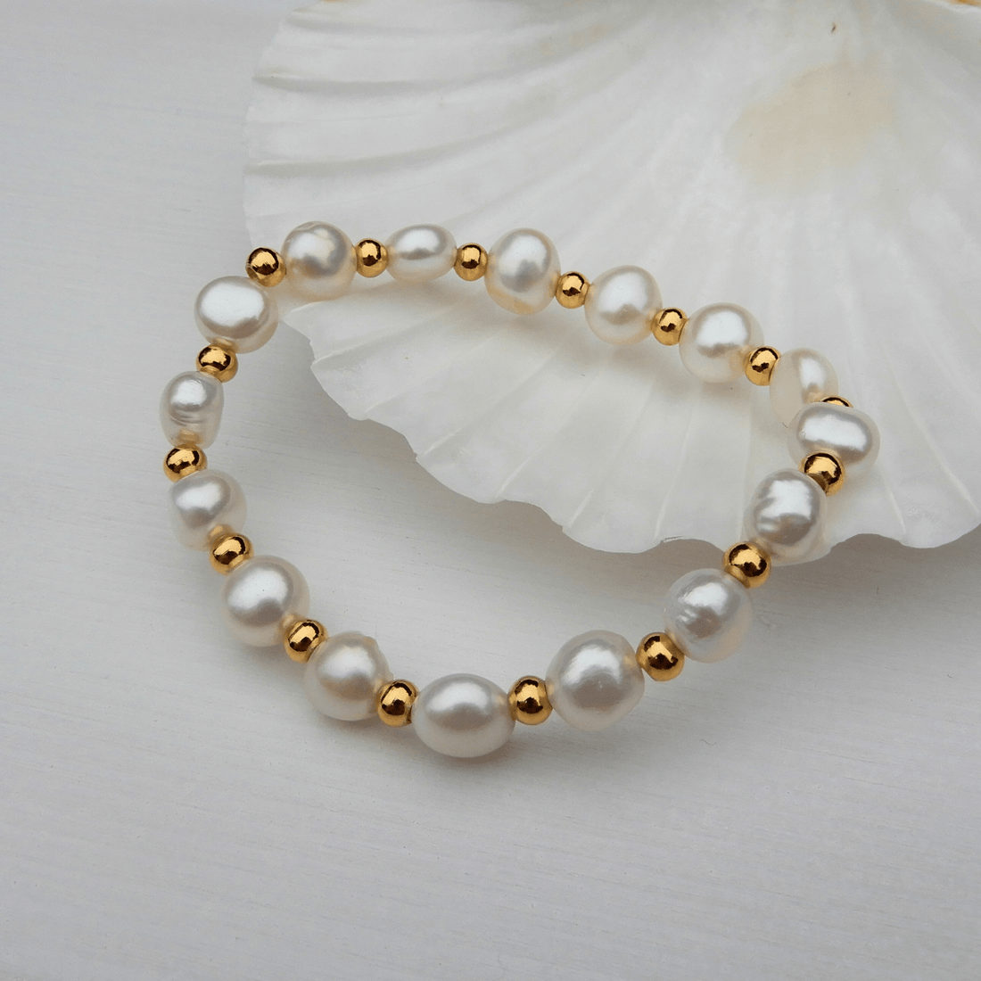 Parel stretch armband goudkleurig 6/7mm, stretch - Gloria Maris Giethoorn