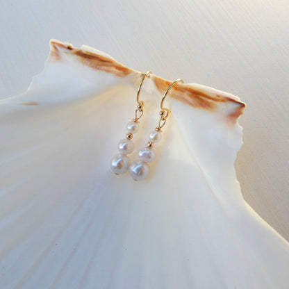 Prachtige zoetwater Parel oorhangers oplopend van maat.